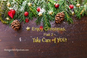 Background of Christmas greenery, pine cones holly berries with text enjoy Christmas take care of you